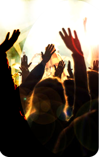 Picture of a crowd waving their arms in the air at an event.