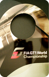 Parking hanger for FIA GT1 World Championship. Laminated, uniquely numbered and barcoded. Slot and hole cut to form a hanger for rear view mirror